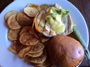 Chicken sandwich with lime aioli and avocado.